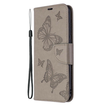 Funda Samsung Galaxy M11 Mariposas en vuelo con colgante
